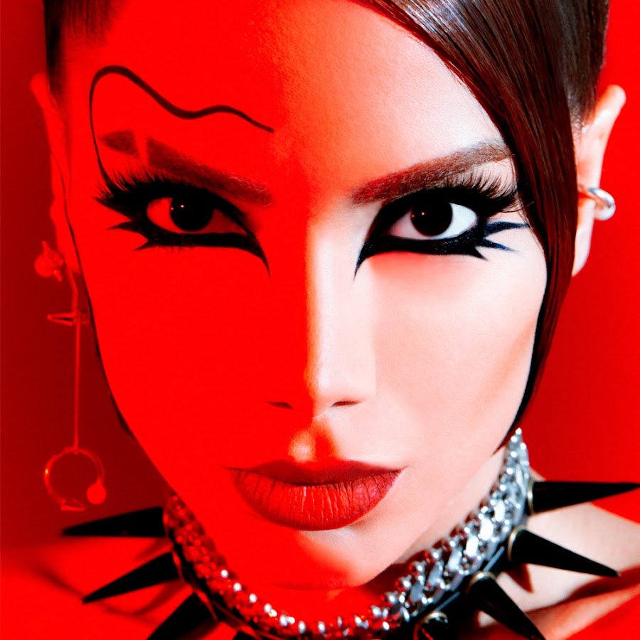 Anitta, Justin Quiles biografia